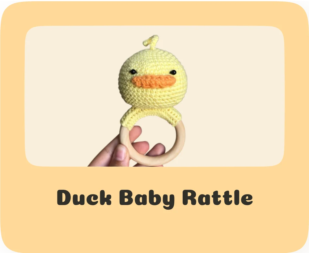Soft and squeaky duck rattle knitting pattern for babies